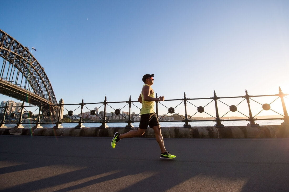 Man running in front of harbour bridge - picture for blog on how to prevent chafing - Debriefs mens underwear